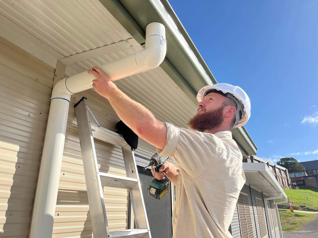 Aidan, licensed plumber and gasfitter, replacing stormwater pipework on a Blue Mountains job